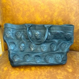Navy Italian leather bag with skull imprint.Purchased from leather shop in Italy